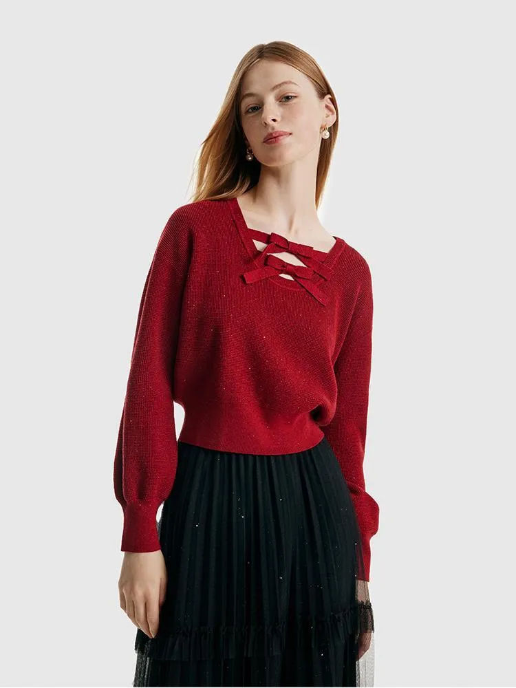 Pull femme en Tencel et laine à manches bouffantes et nœuds papillon